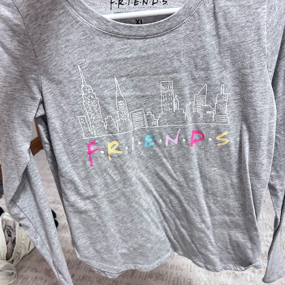 2 gray long sleeve shirts